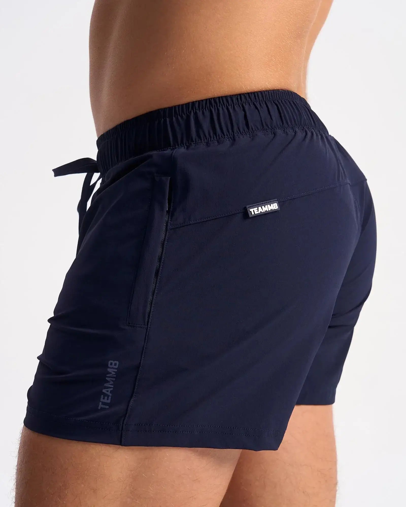 Navy blue bolt 3 inch shorts with elastic waistband and side pockets made of breathable athletic material