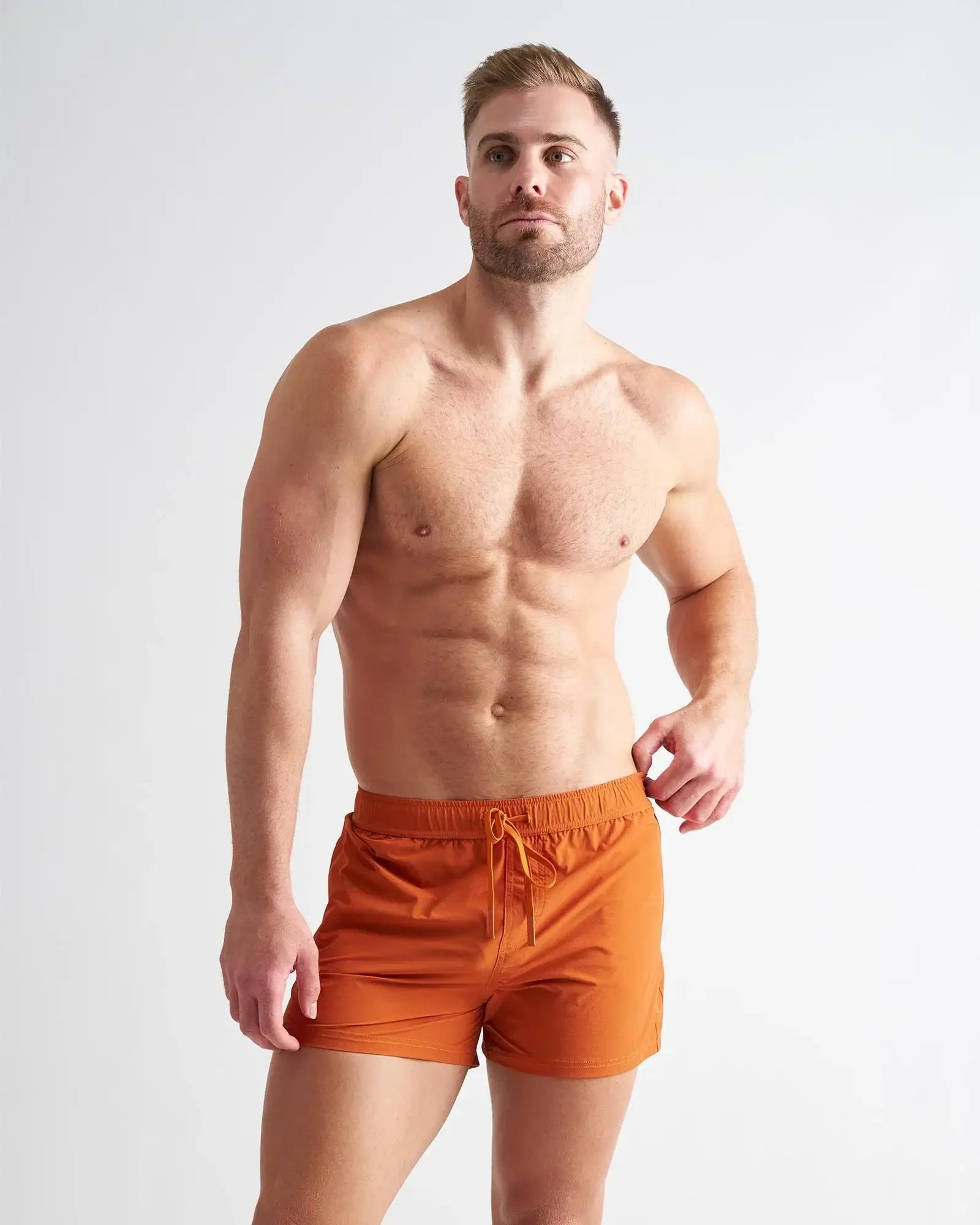 Orange bolt 3 short athletic swim trunks with drawstring waistband designed for active water use