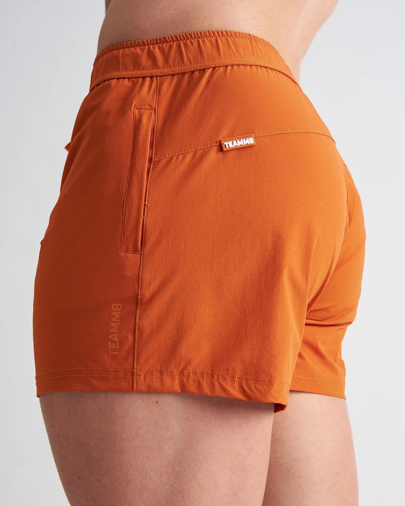 Orange bol t 3 inch athletic shorts with fitted waistband and side pocket for active wear