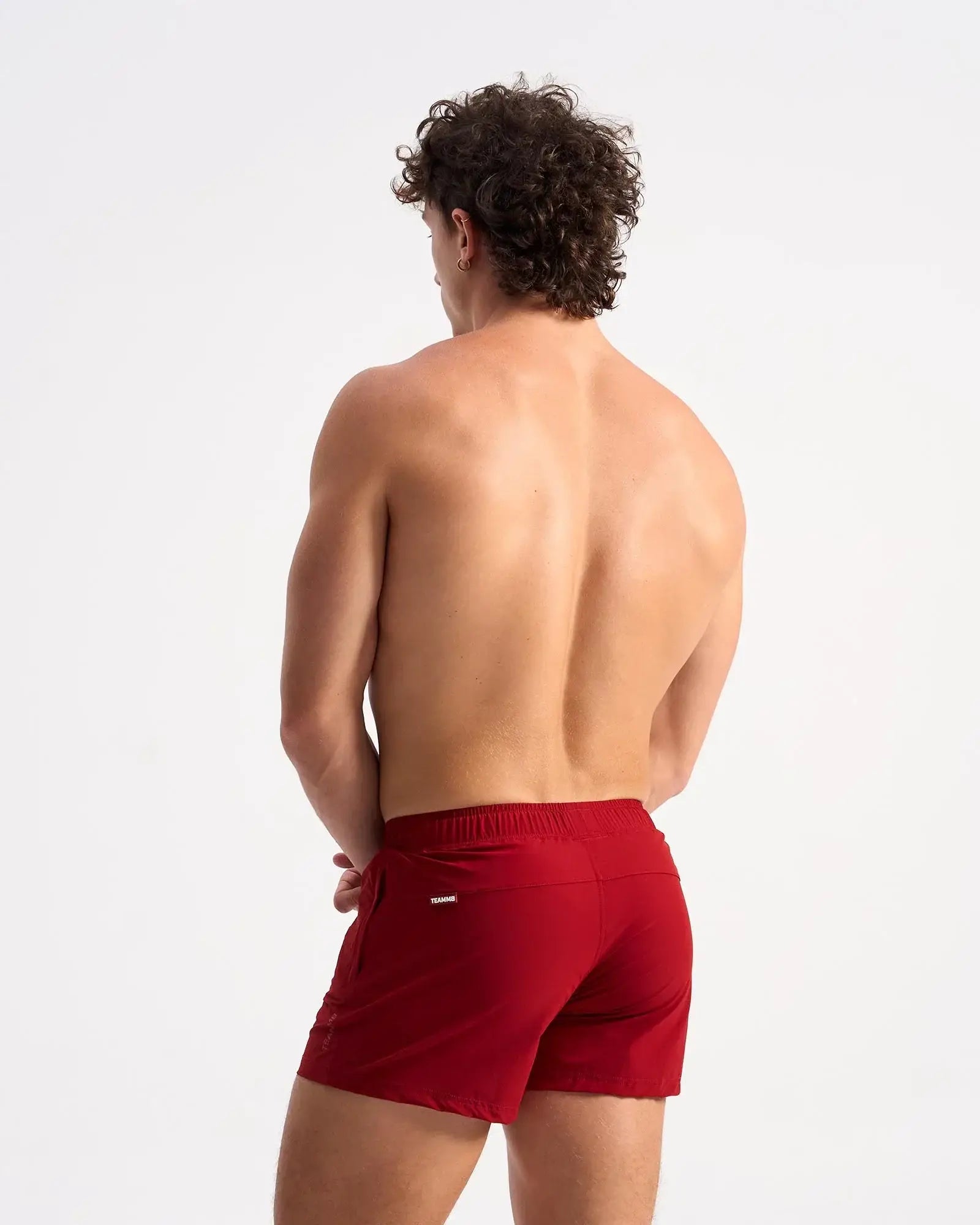 Bolt 3 short red athletic shorts with snug elastic waistband and small brand logo on the side seam