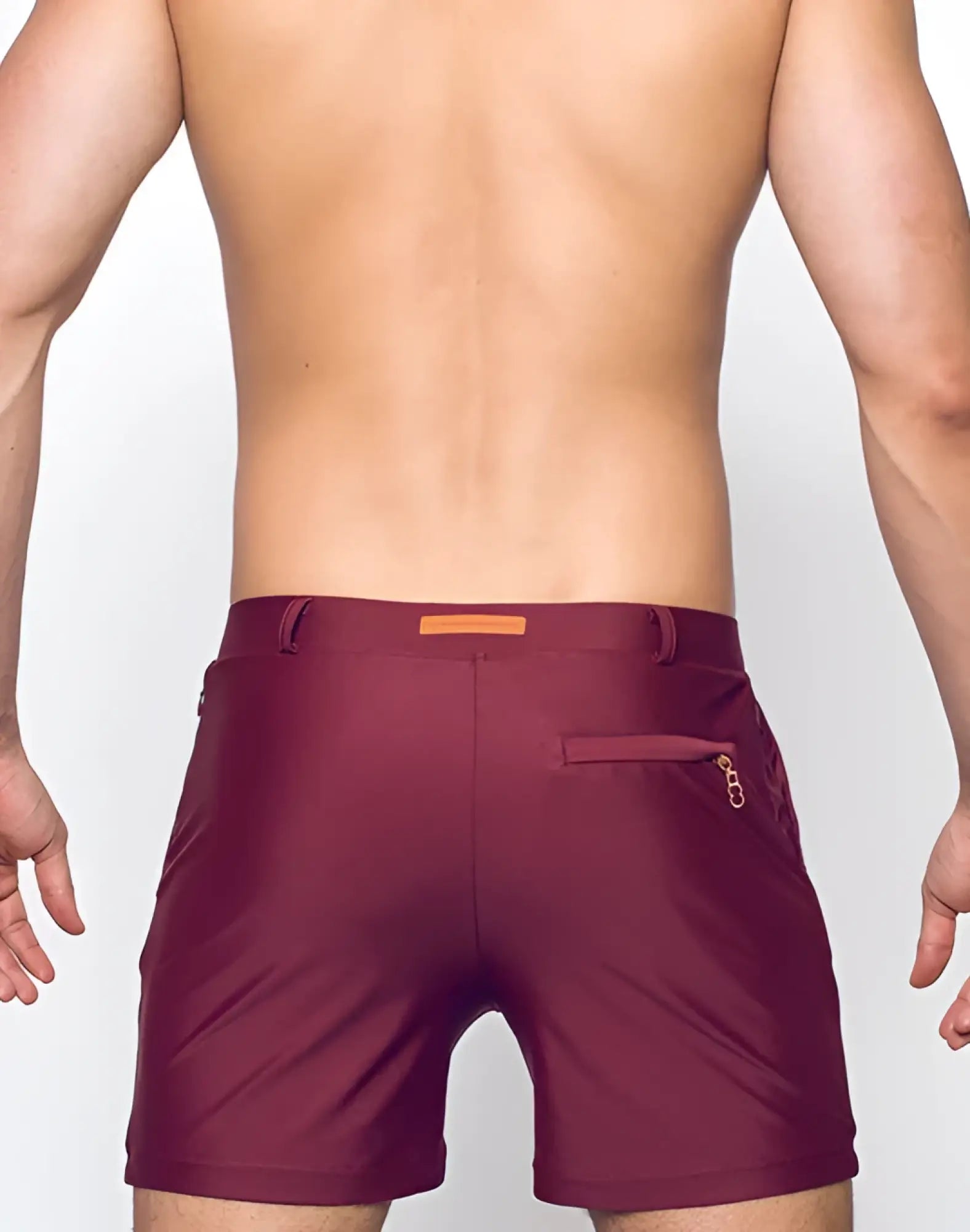 Maroon bondi short athletic shorts with subtle textured finish and orange rectangular brand tag at the waistband