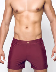 Maroon bondi short swim trunks with sleek form-fitting design and subtle brand logo on the lower right leg