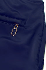 Navy blue bondi short made of nylon featuring a gold-toned zipper pull with an oval ring design