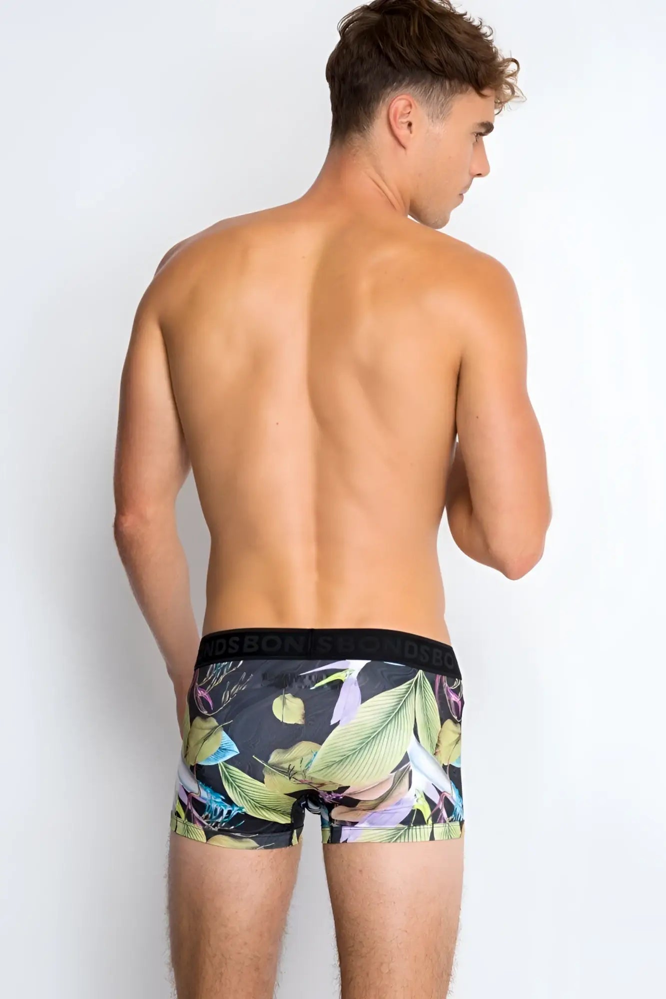 Bonds Fit Luxe trunk boxer brief underwear in black with vibrant green yellow and purple tropical leaf pattern size xs