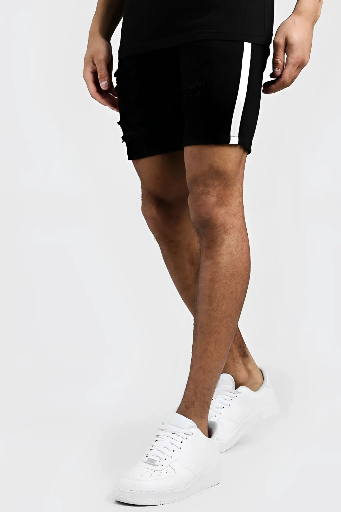 Black distressed boohoo skinny fit denim shorts with white vertical side tape in size 32