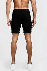 Black denim shorts by boohoo featuring a skinny fit, side tape detail, and a subtle waistband brand label size 32