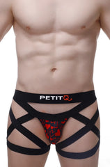 Black strappy men’s boxer brief with red heart pattern and petitq logo on waistband king of hearts design