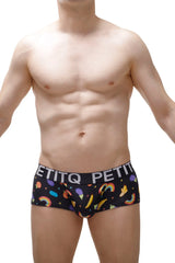Black men’s boxer brief taik sitges with playful rainbow banana pattern and petitq white waistband lettering