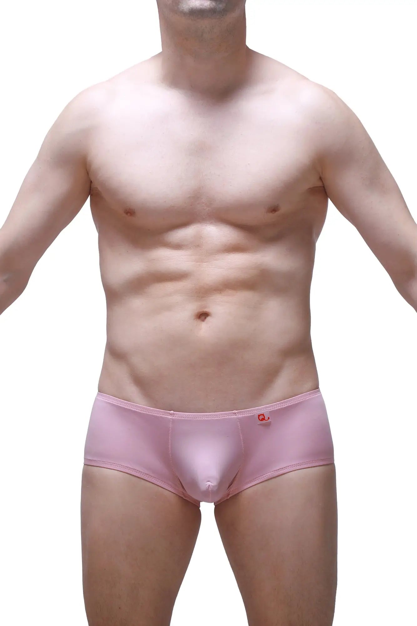 Pink men’s boxer briefs in tea rose with a small red logo on the waistband designed for chill comfort