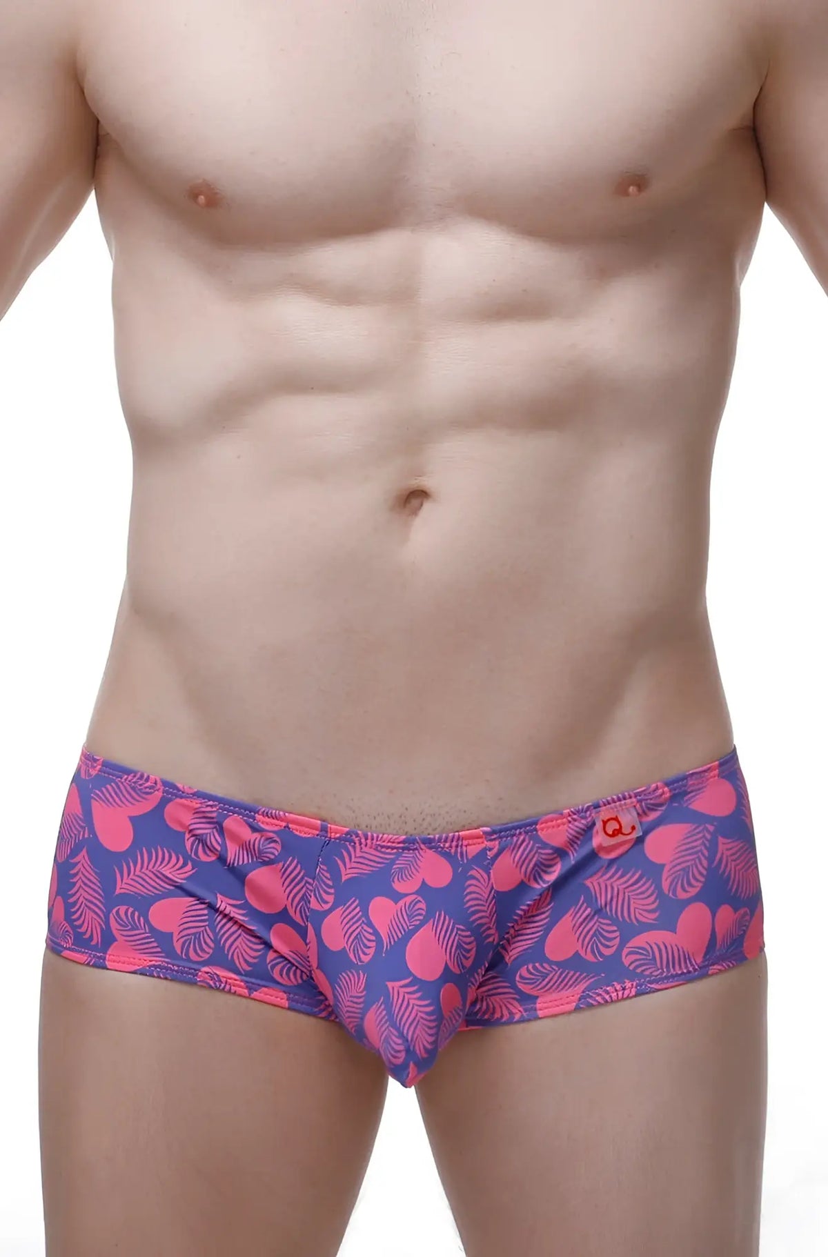 Vibrant pink and purple boxer chill tropical hearts swim trunks with heart and leaf patterns for casual beachwear