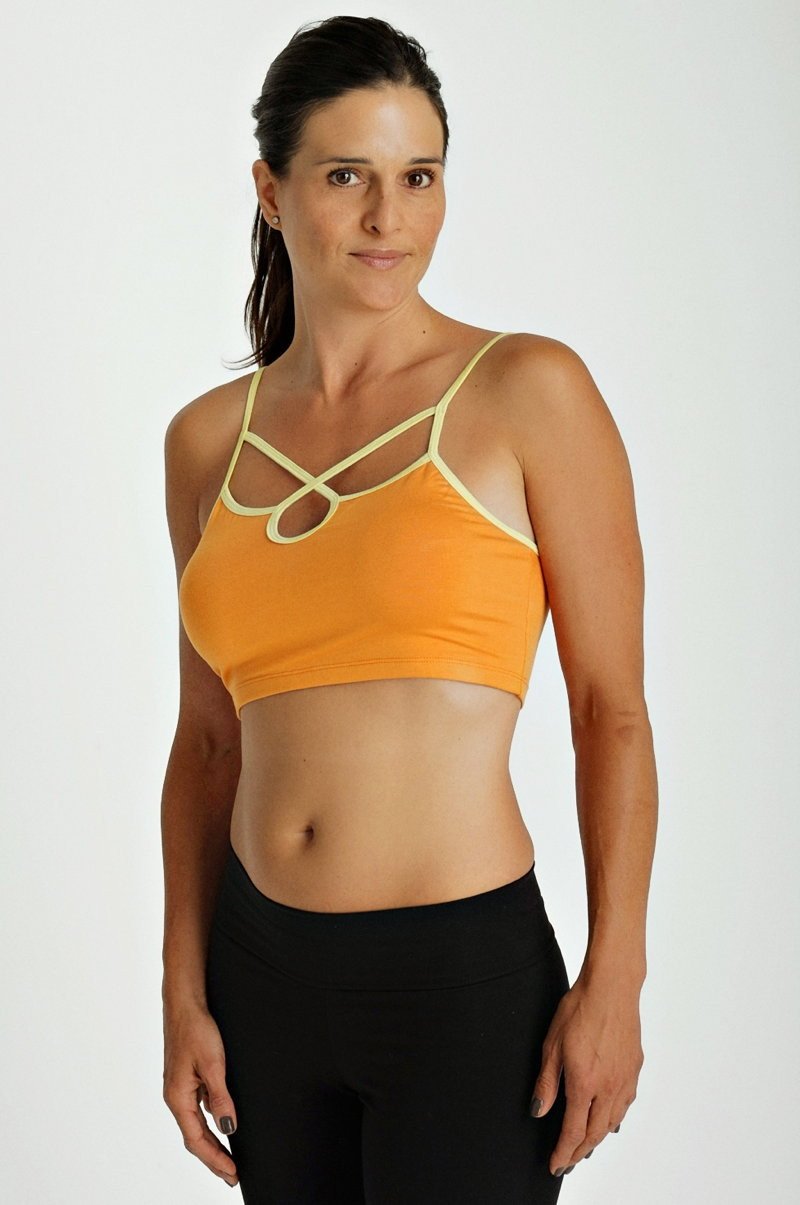 Orange sports bra top tangerine with cream crisscross straps and racerback design for activewear use