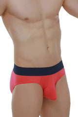 Bright coral red briefs with a contrasting navy blue waistband made from soft modal fabric in fuchsia color