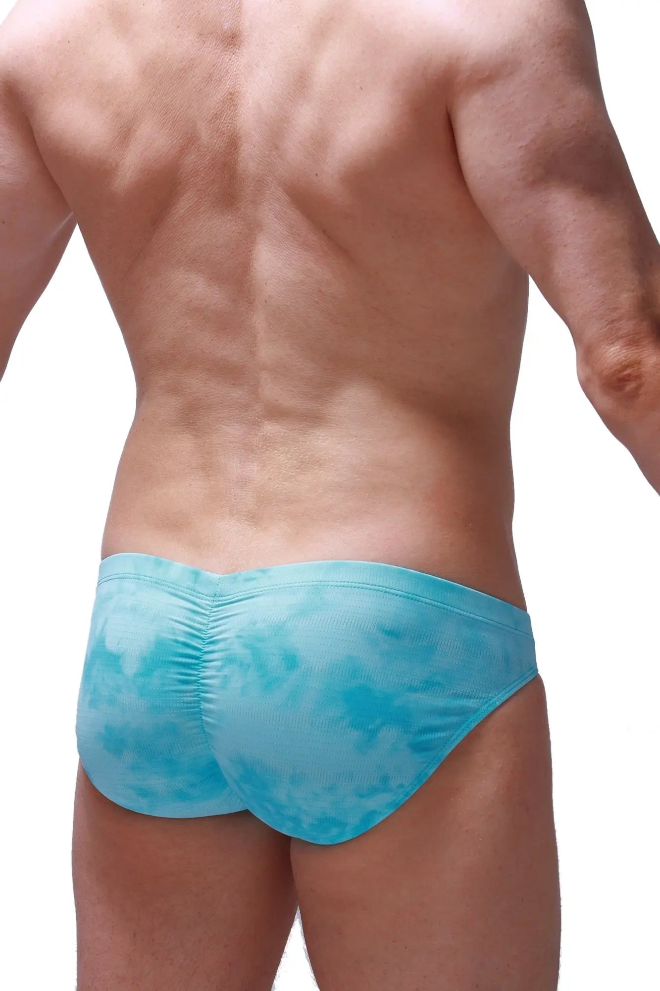 Light blue tie-dye swim trunks with ruched back design in brief peraut marbre green style