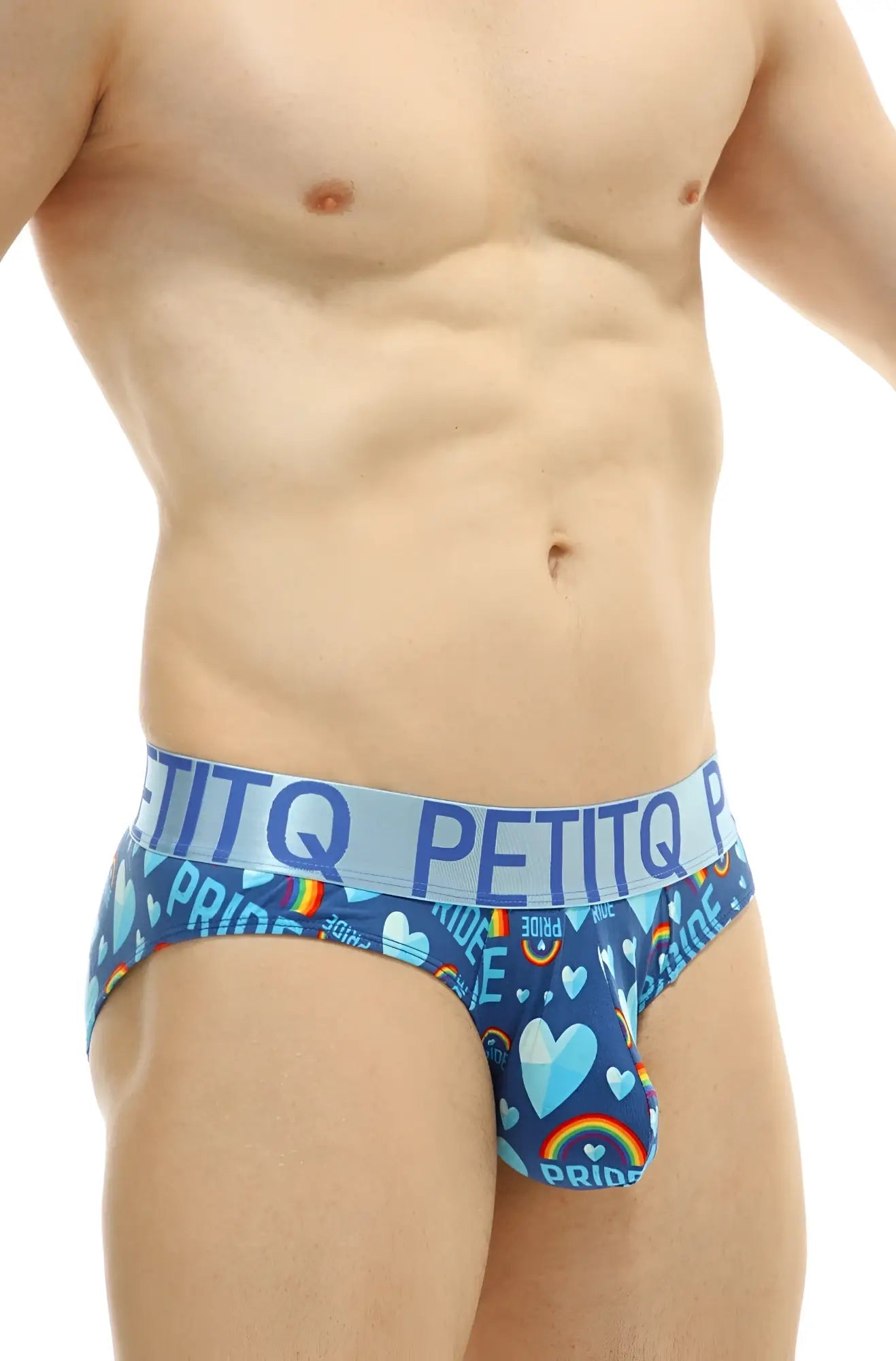 Blue petitq men’s briefs with a vibrant rainbow heart pattern and pride text for pride celebration wear