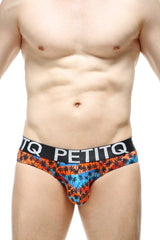 Brief protruder temae men’s briefs with orange and blue tropical palm pattern and black waistband with petitq branding