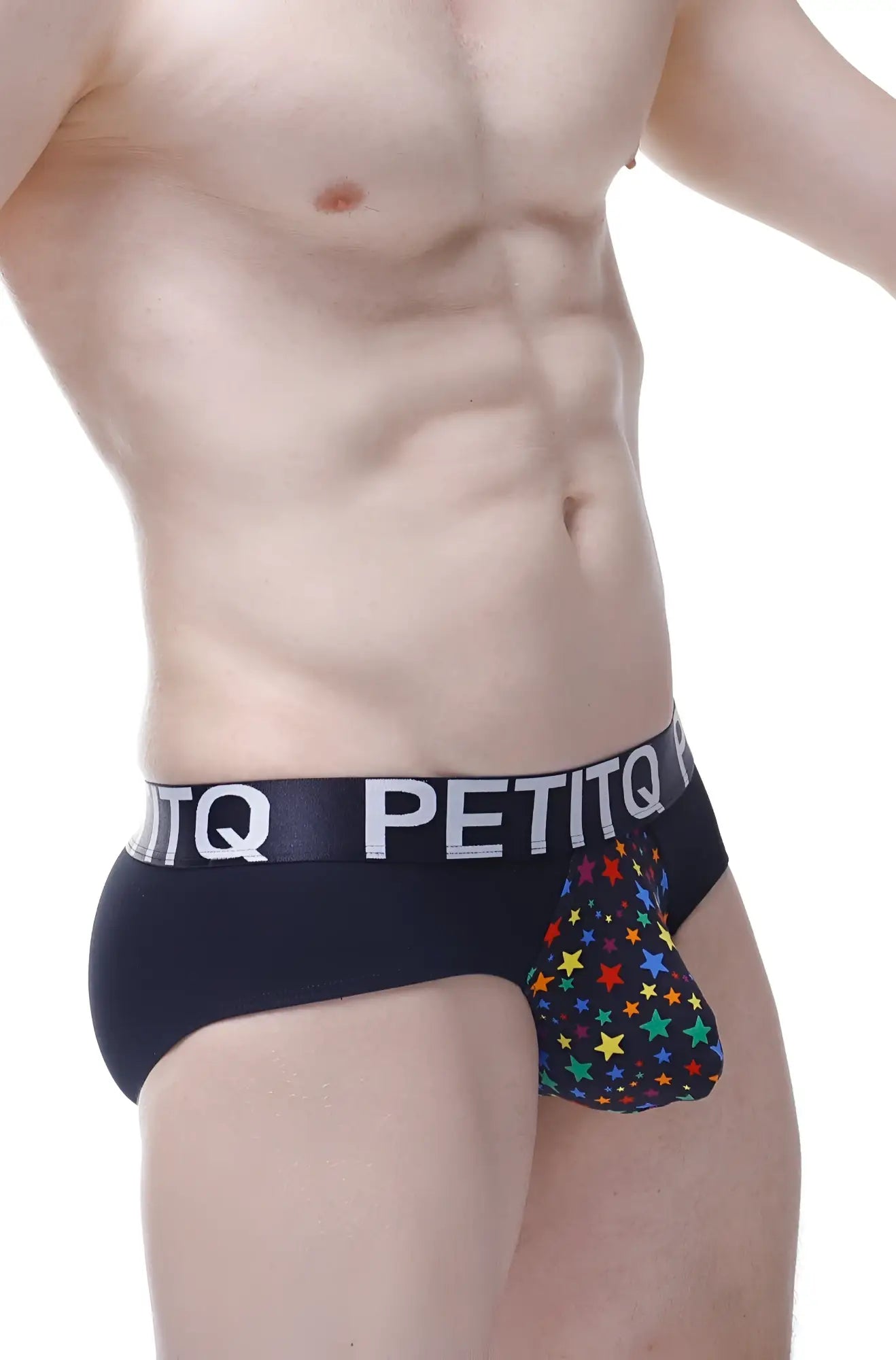 Black petitq briefs with a colorful rainbow star pattern on the pouch from the brief stars rainbow collection