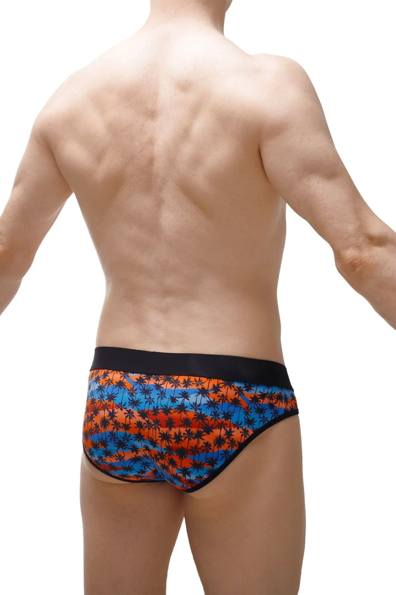 Brief temae swim trunks featuring vibrant orange and blue tropical palm tree pattern with black elastic waistband