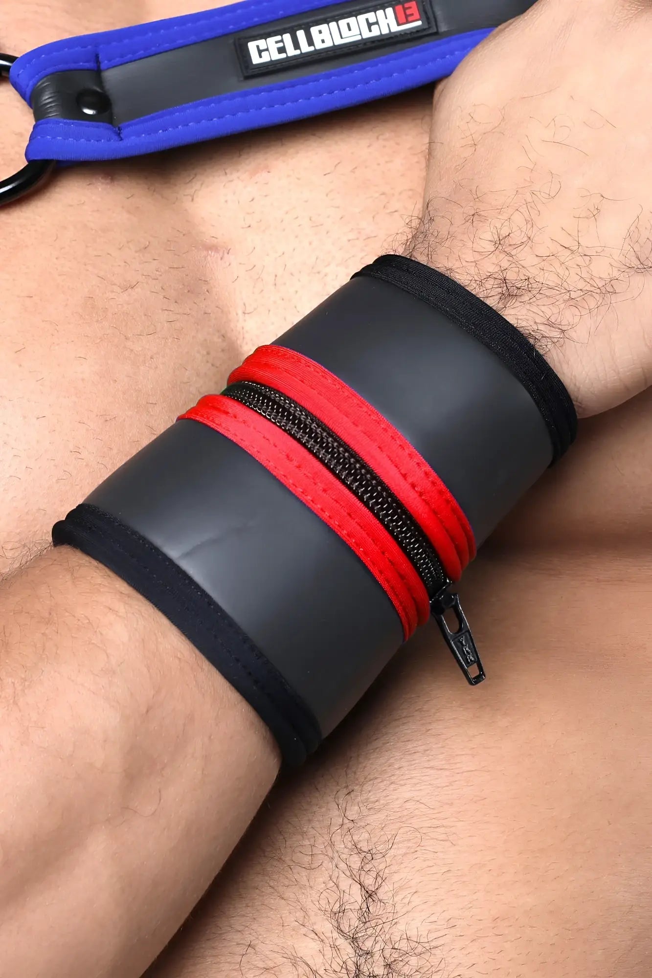 Black and red leather buckle up cuff wristband with zipper closure and cellblock branded blue strap available in five colors