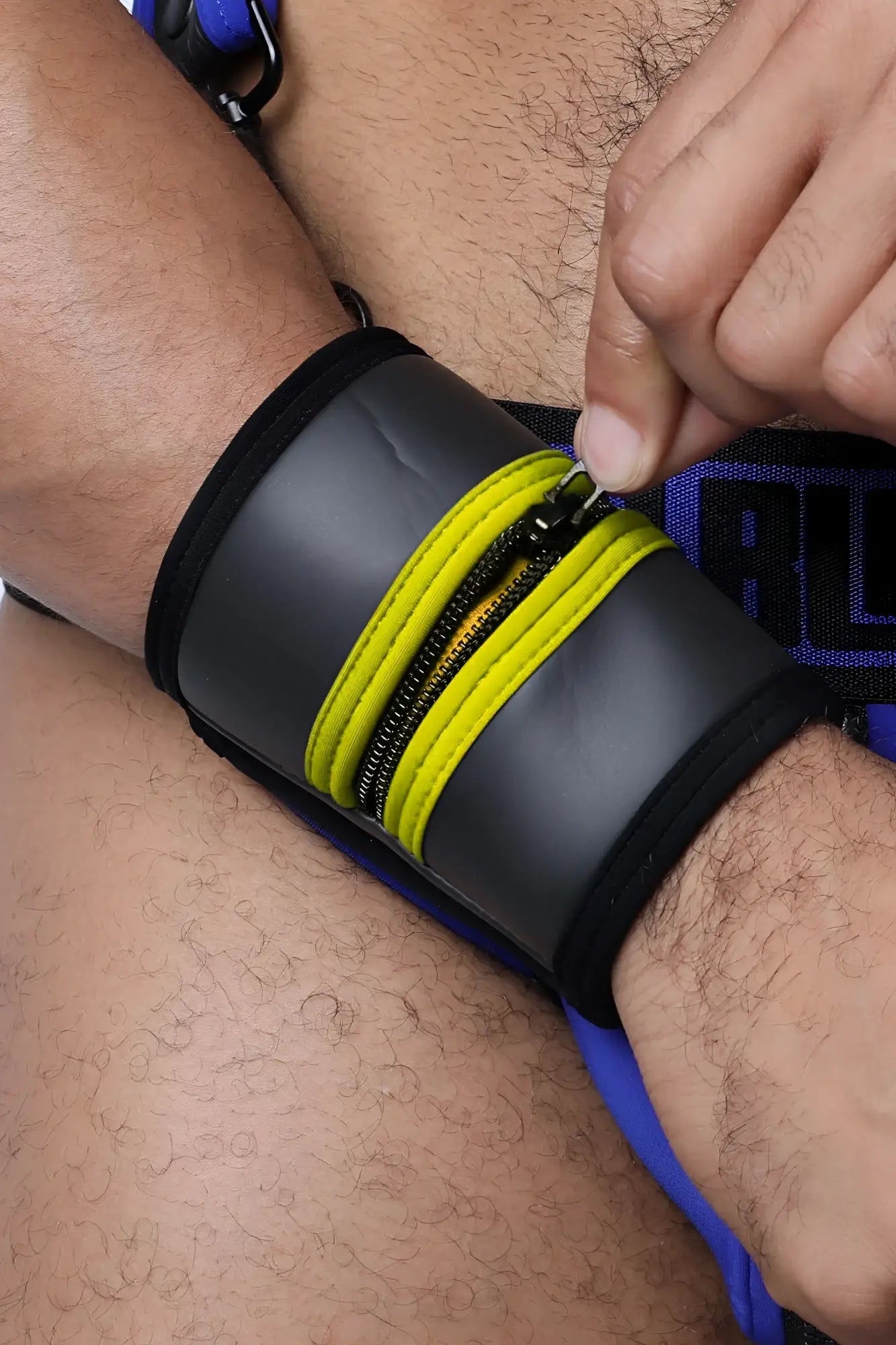 Black buckle up cuff wristband with bright yellow zipper accents available in 5 colors for stylish wear