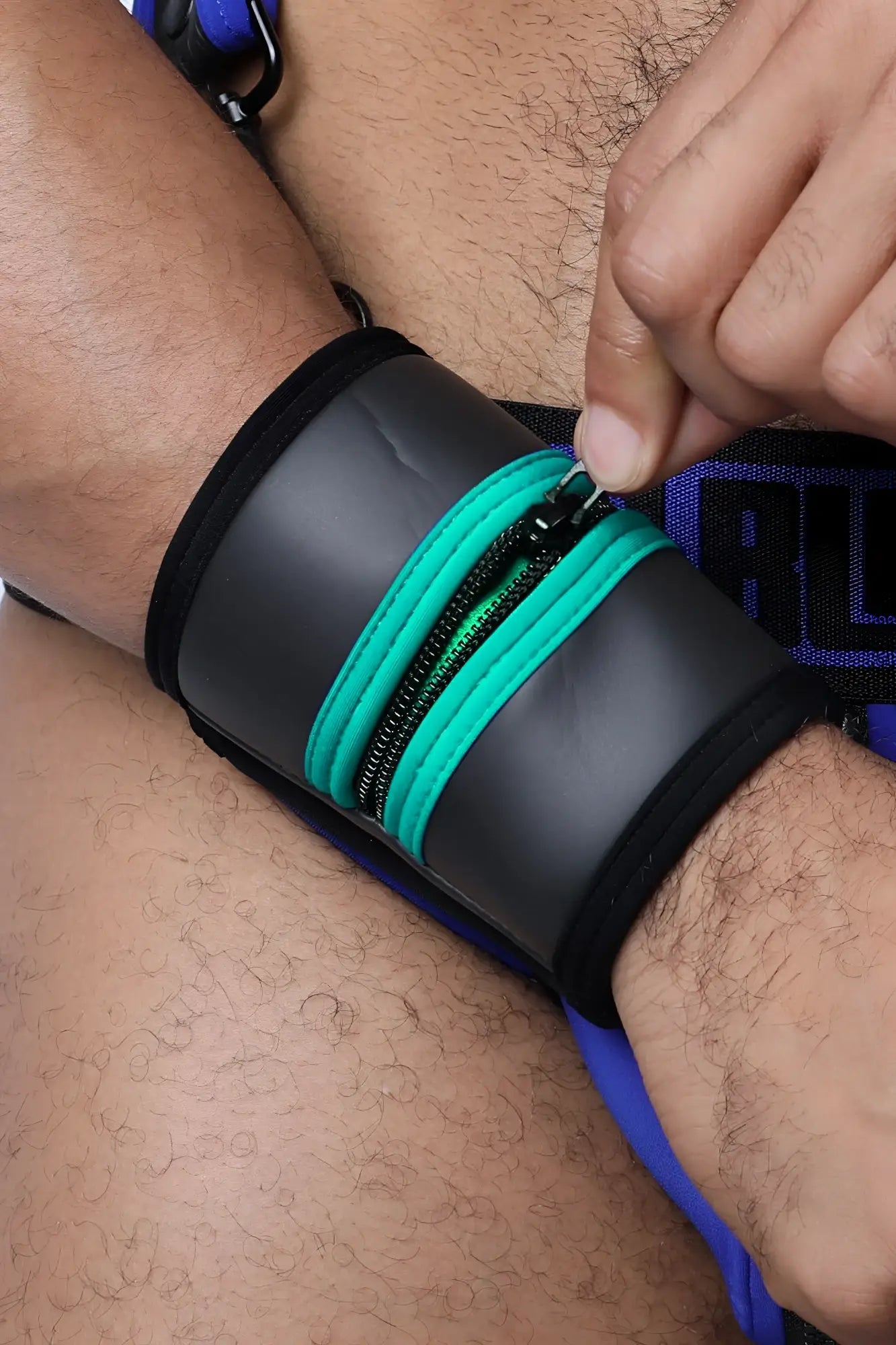 Black buckle up cuff wristband with teal zipper accents available in five colors for stylish wear