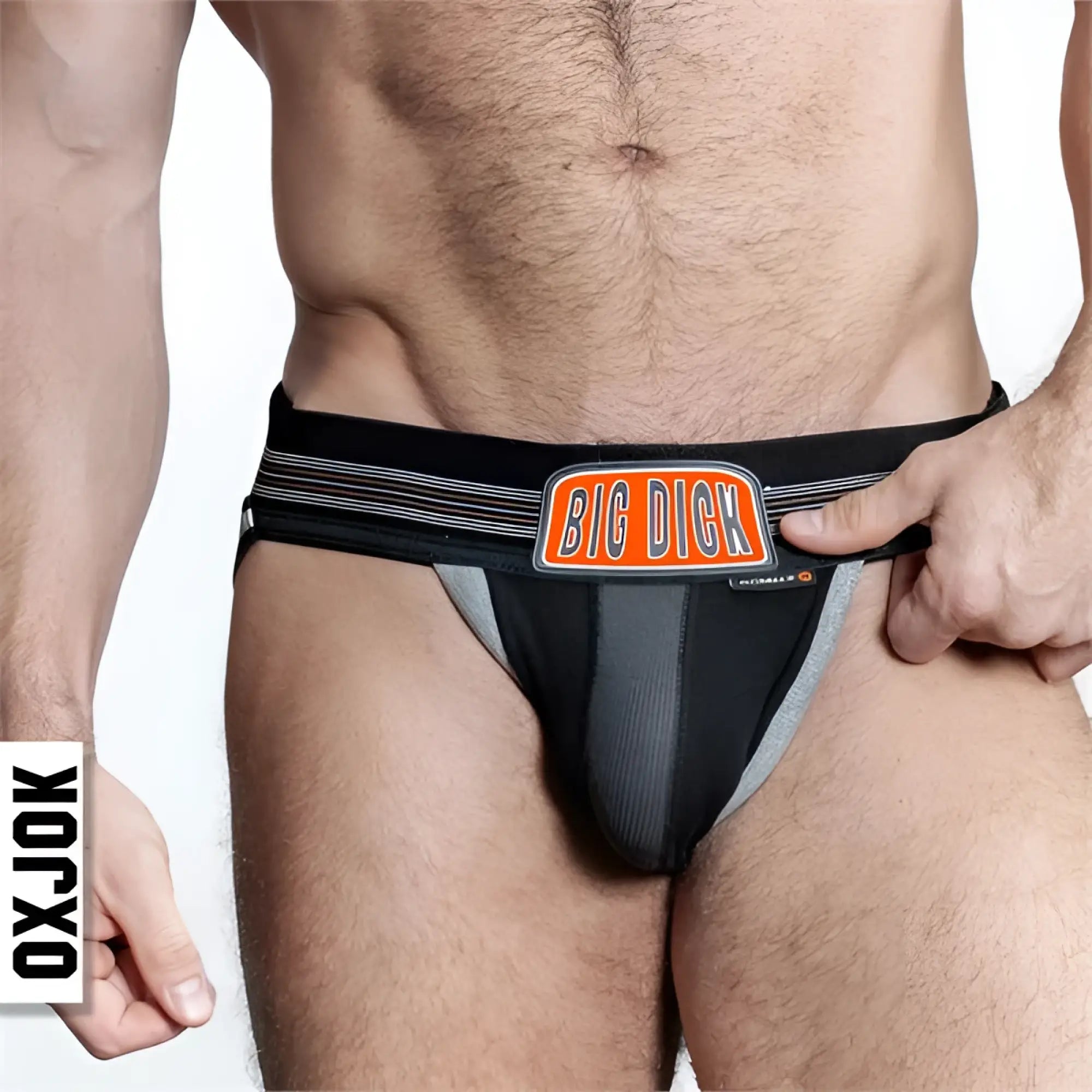 Black and gray bulger jockstrap with orange big dick logo patch and subtle striped pattern on the side waistband