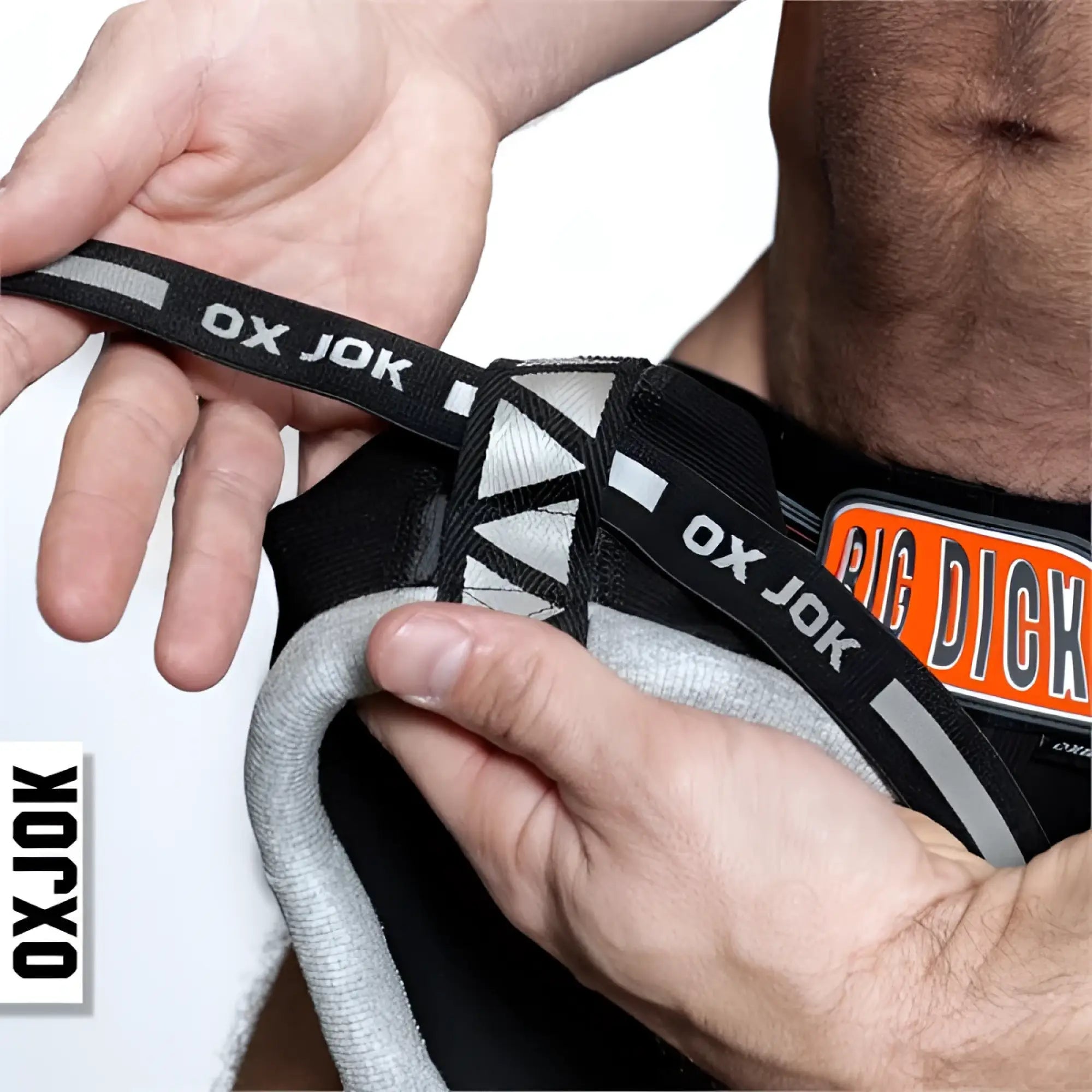 Bulger jockstrap with black and gray ox jok branded lacing and reflective stripes for enhanced visibility