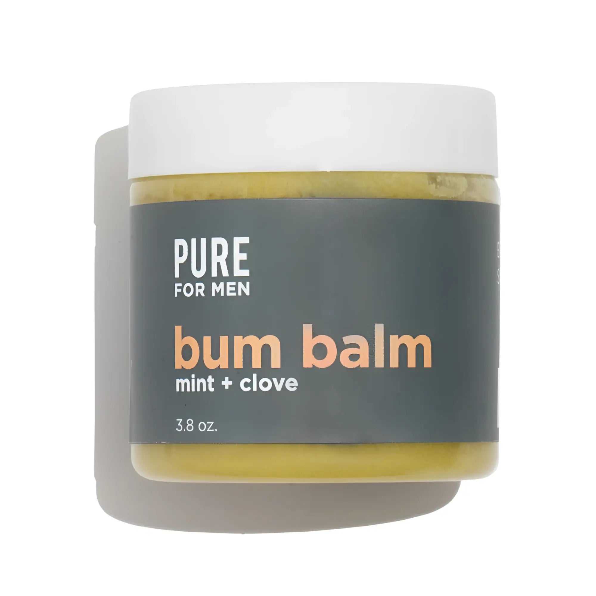 A matte white jar of pure for men bum balm with a dark gray label containing yellowish-green mint and clove balm