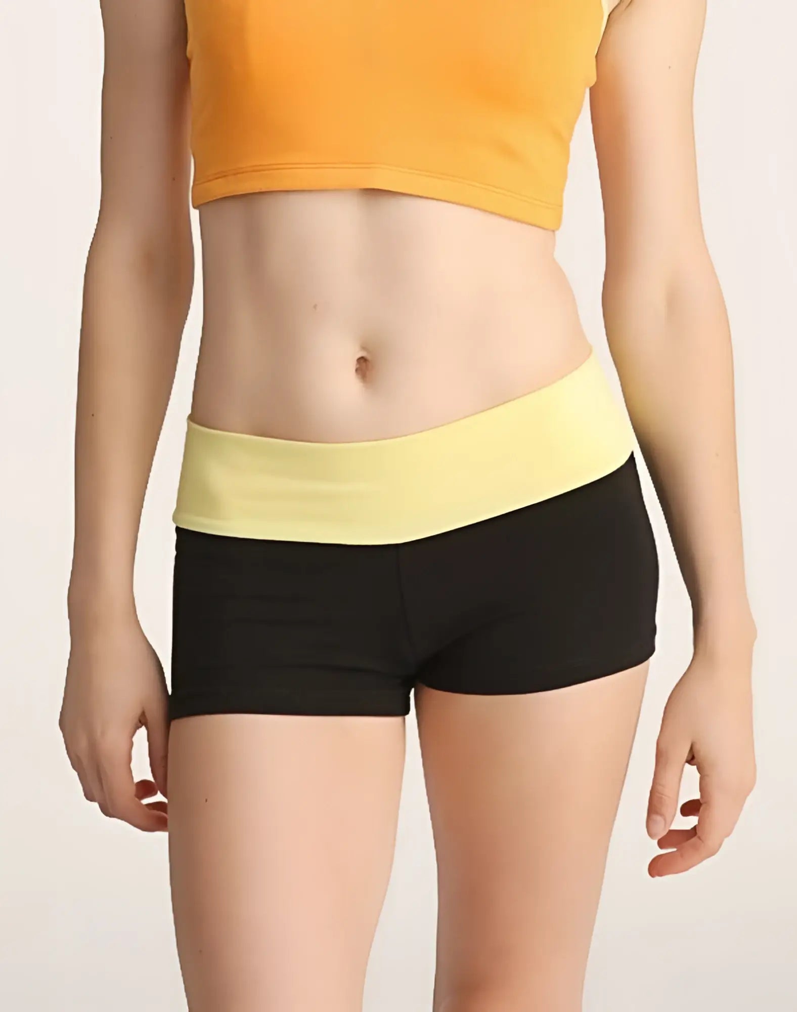 Black and yellow bumble short athletic shorts with a wide elastic waistband for active wear