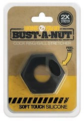 Black hexagonal silicone cock ring with central hole and side cutouts in bust-a-nut cardboard blister pack by bone yard