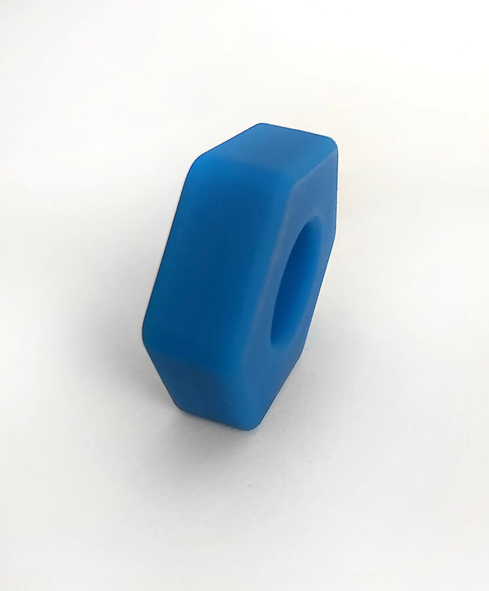 Blue silicone hexagonal nut from bust a nut featuring durable flexible material for secure fastening applications