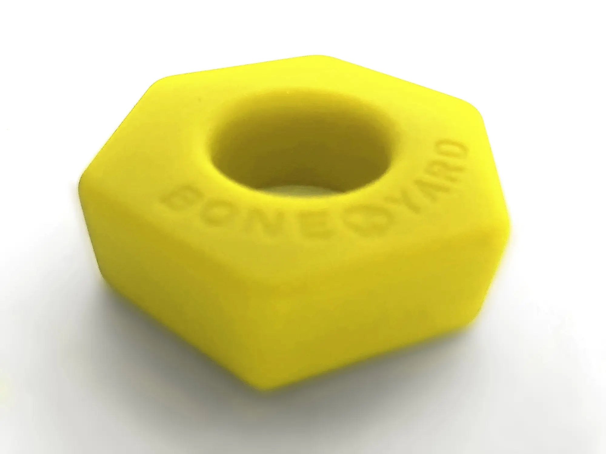 Bright yellow hexagonal silicone nut embossed with boneyard for grip and protection bust a nut yellow