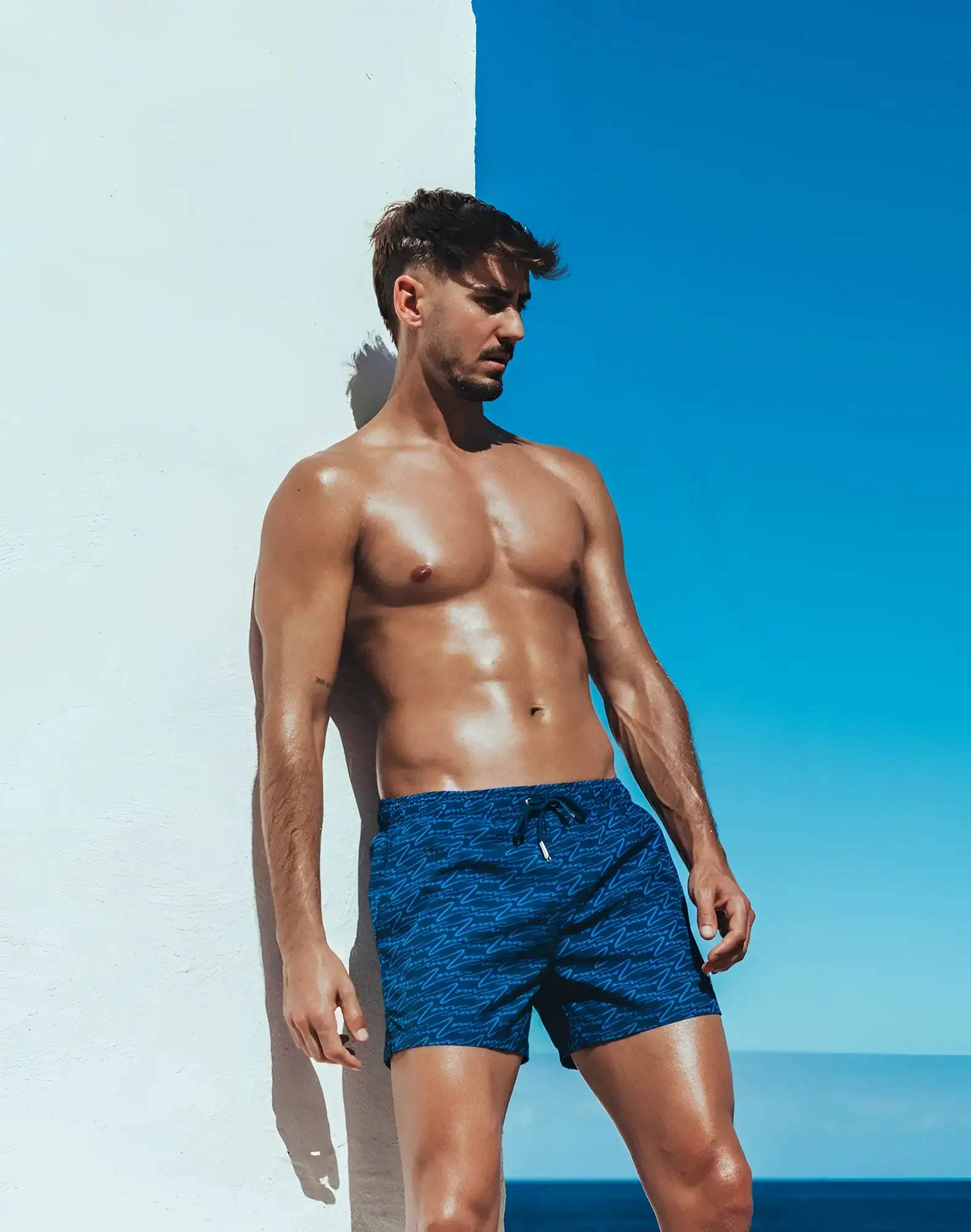 Byron swim short with signature blue patterned fabric and a drawstring waistband for comfortable swimming
