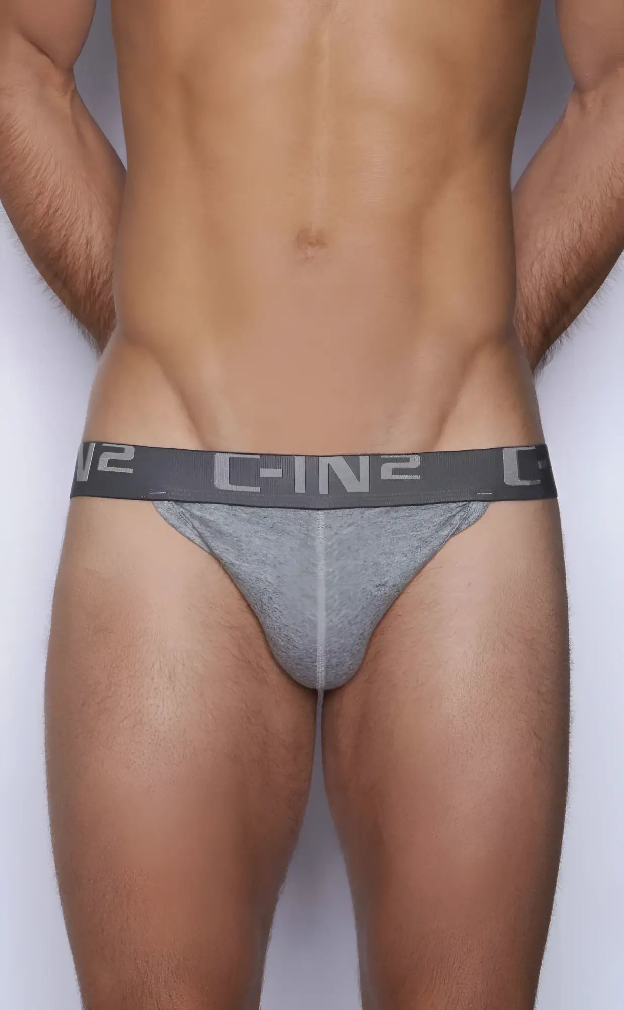 Gray c-in2 y-back thong briefs with textured fabric and elastic waistband showing the back side of the product
