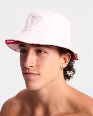 White cabana bucket hat with red and blue striped brim featuring teammb branding and breathable fabric
