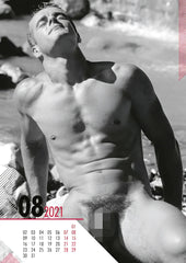 Black-and-white calendar page from 2021 hc real cocks pin up featuring a man at the beach and monthly grid