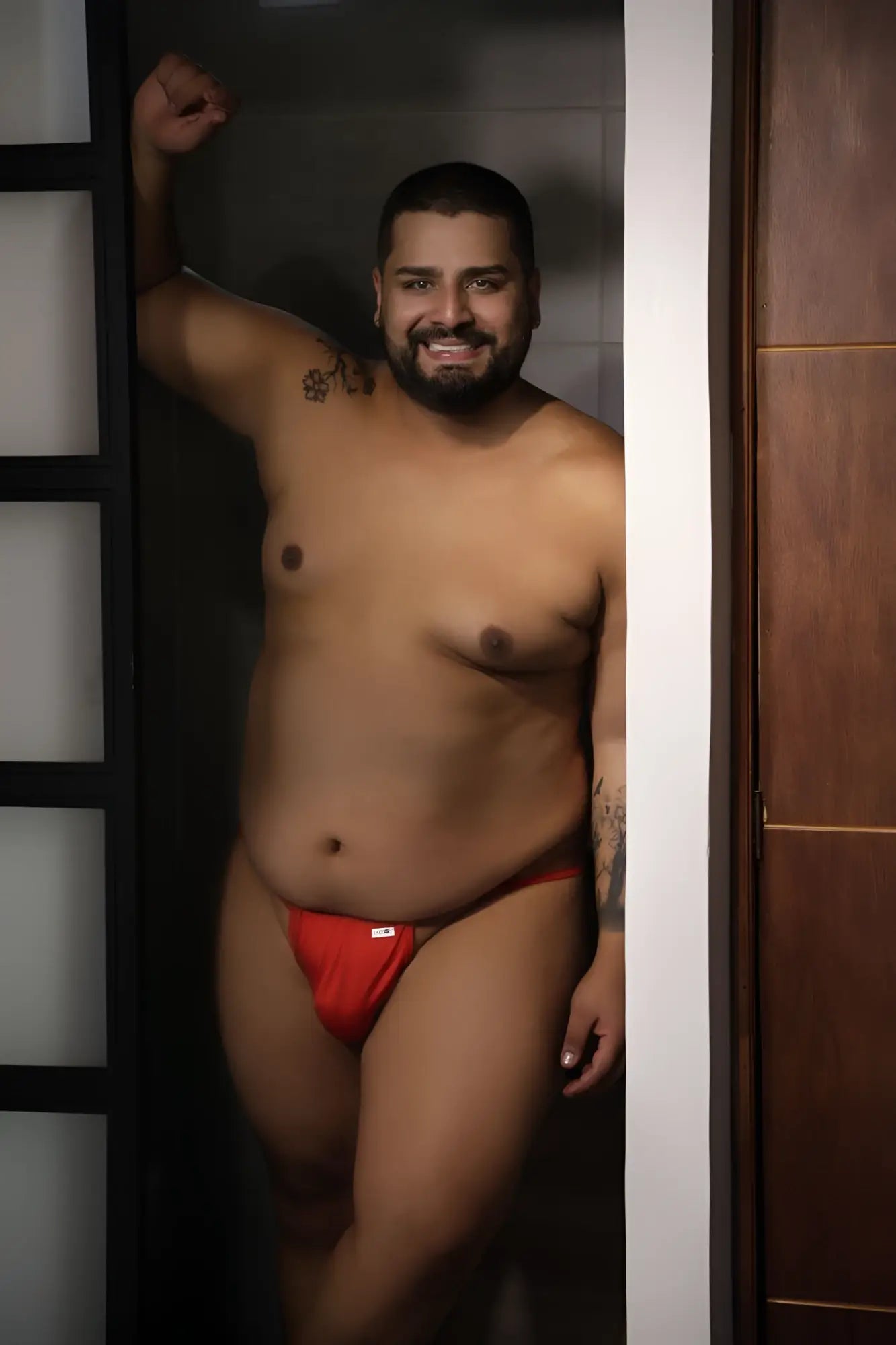 Red CandyMan 9586X thongs with a small white logo on the front made of soft breathable fabric