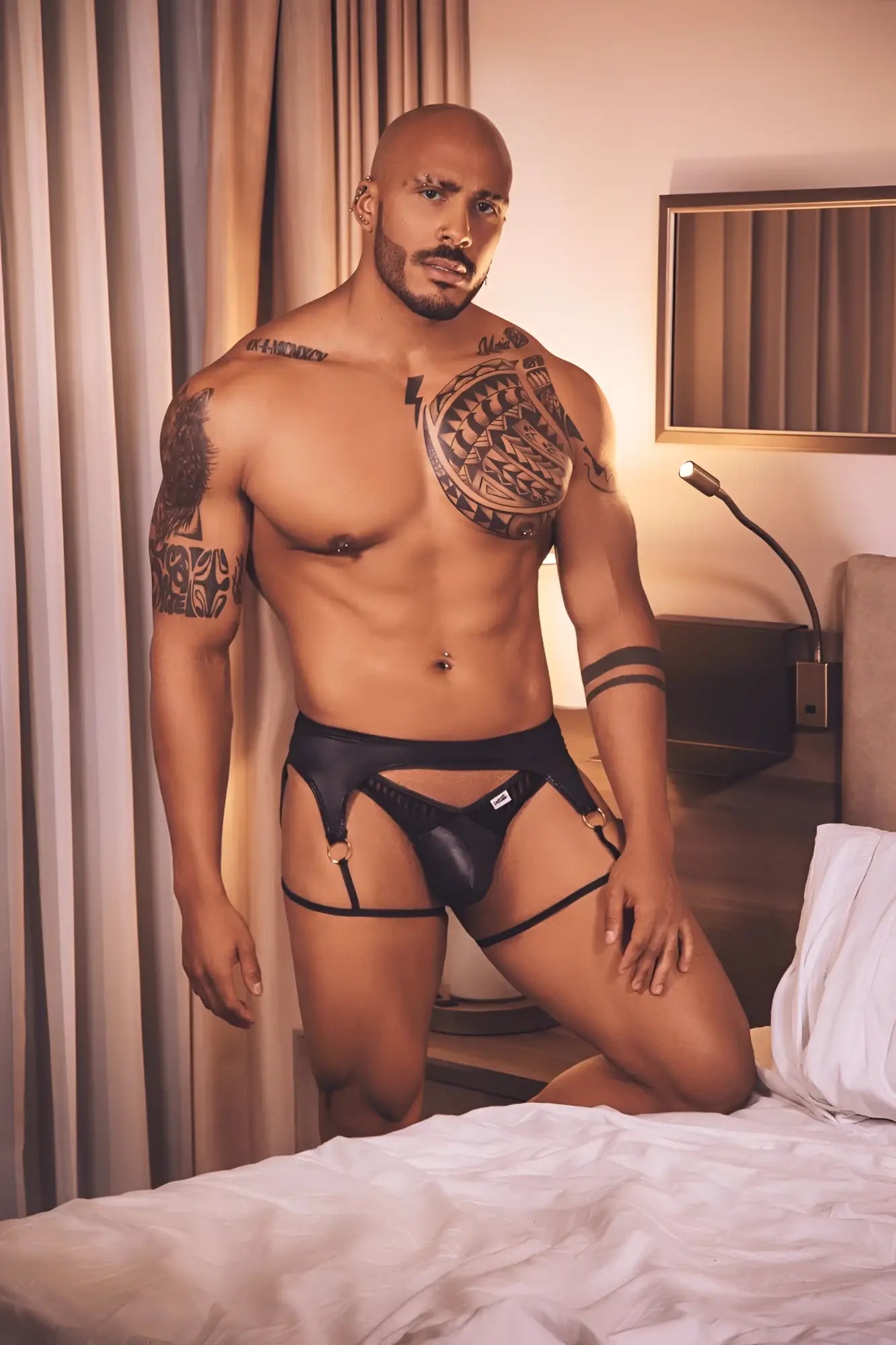 Black leather thong with adjustable straps and small white logo on front from candyman 99655 garter thongs collection