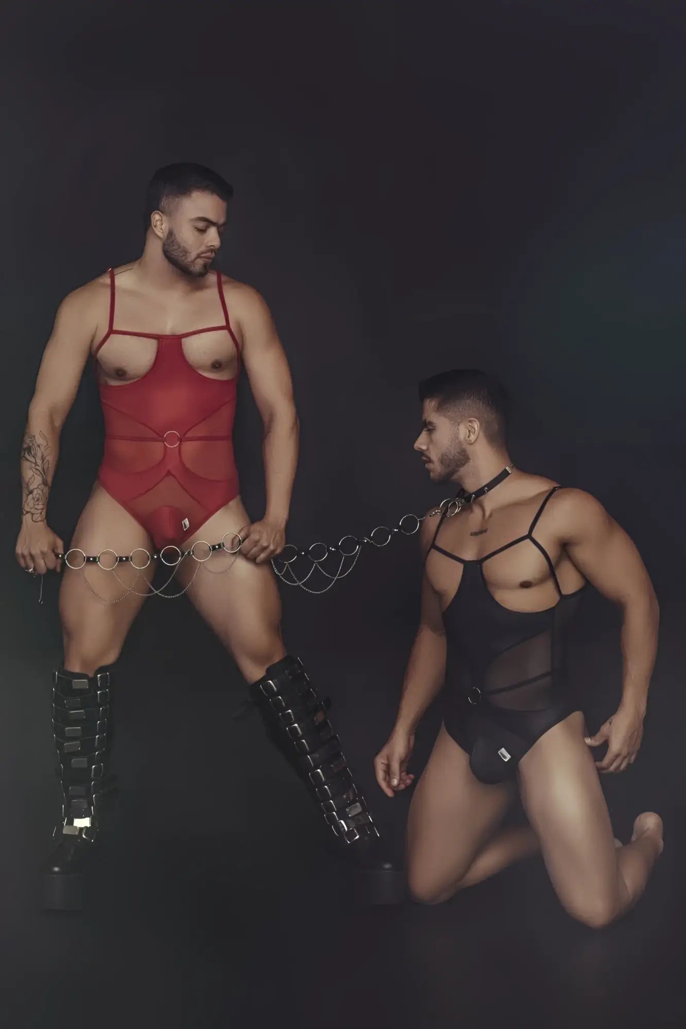 Candyman 99670 harness bodysuit in red mesh with thin straps and central circular buckle for a bold look