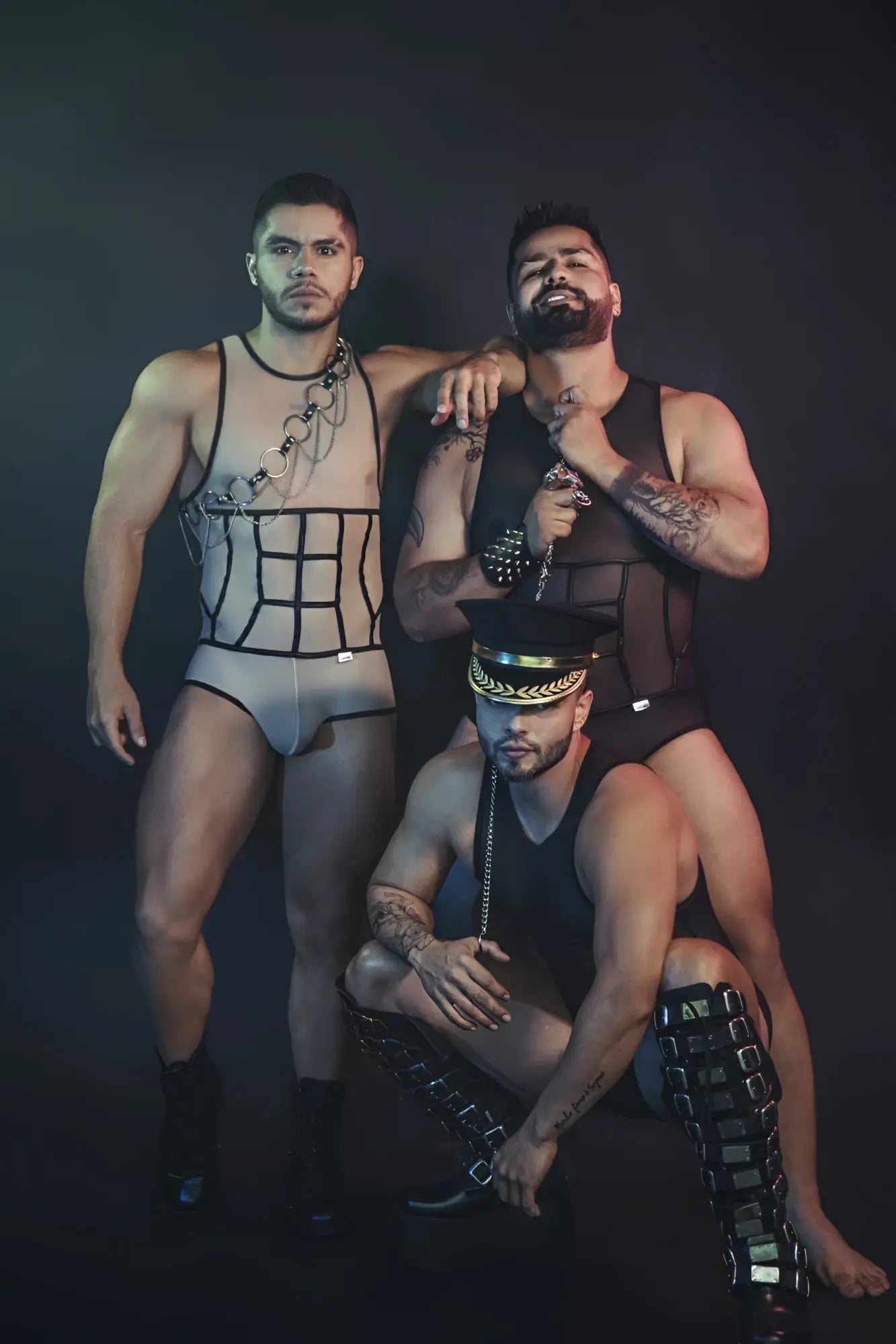 Black leather harness with silver chain accents and a gold-trimmed cap paired with candyman 99683x black tulle bodysuit