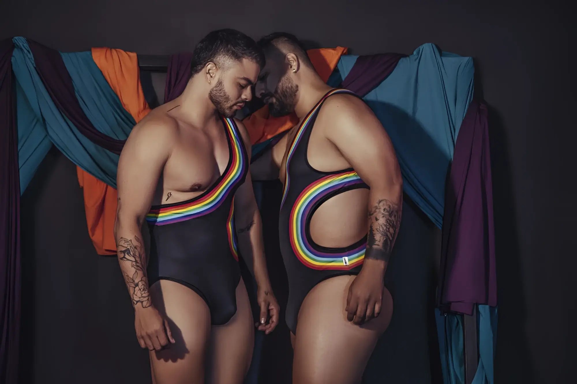 Black candyMan 99702X one-piece swimsuit with rainbow-colored stripes and cutouts for stylish swimwear looks
