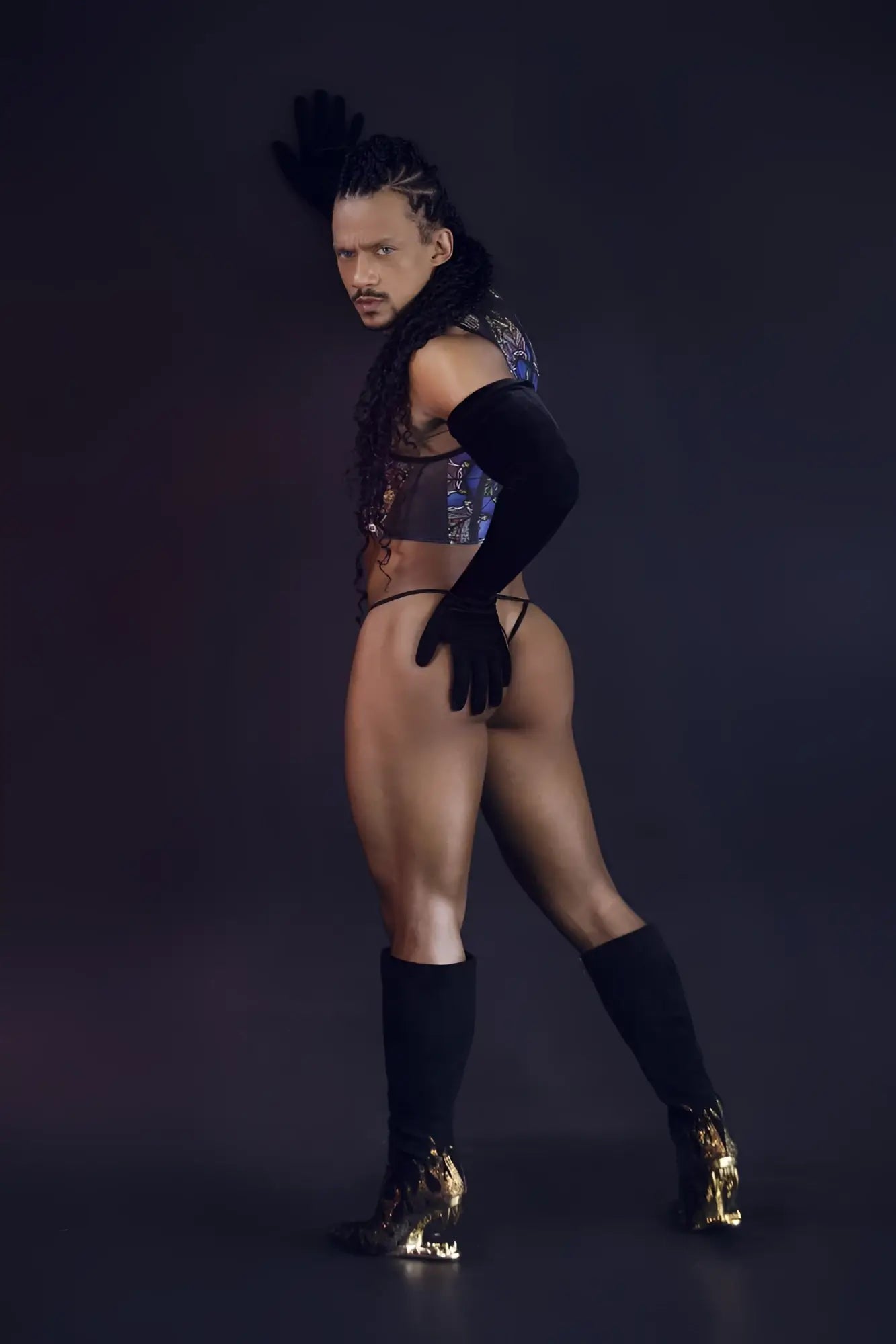 Black high-heeled boots with gold flame detailing paired with a black stained glass print tank top candyMan 99805