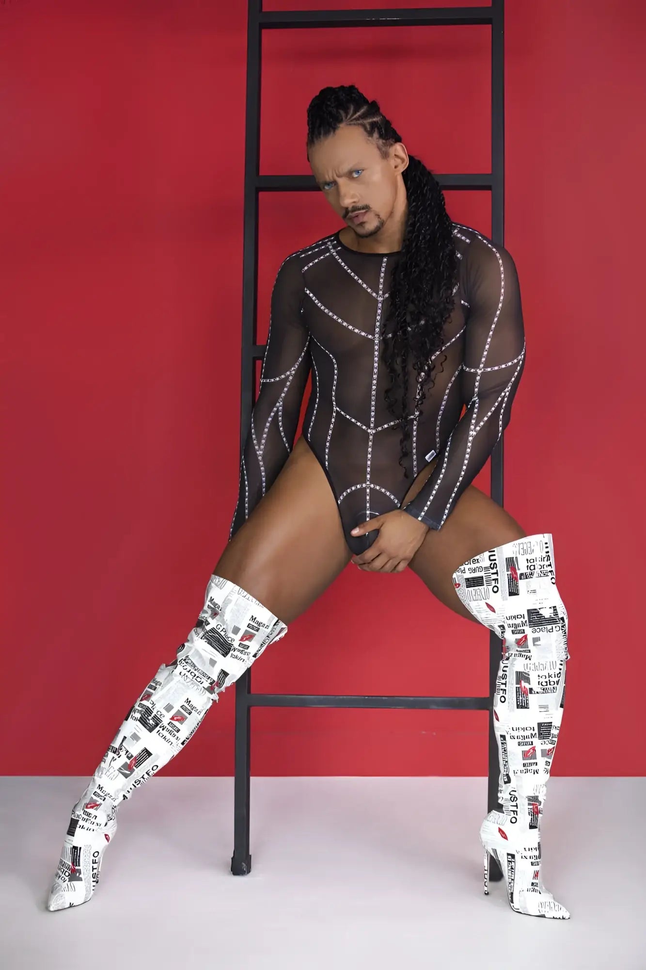 White over-the-knee boots with black text and graphic collage print paired with candyman 99816 black mesh bodysuit