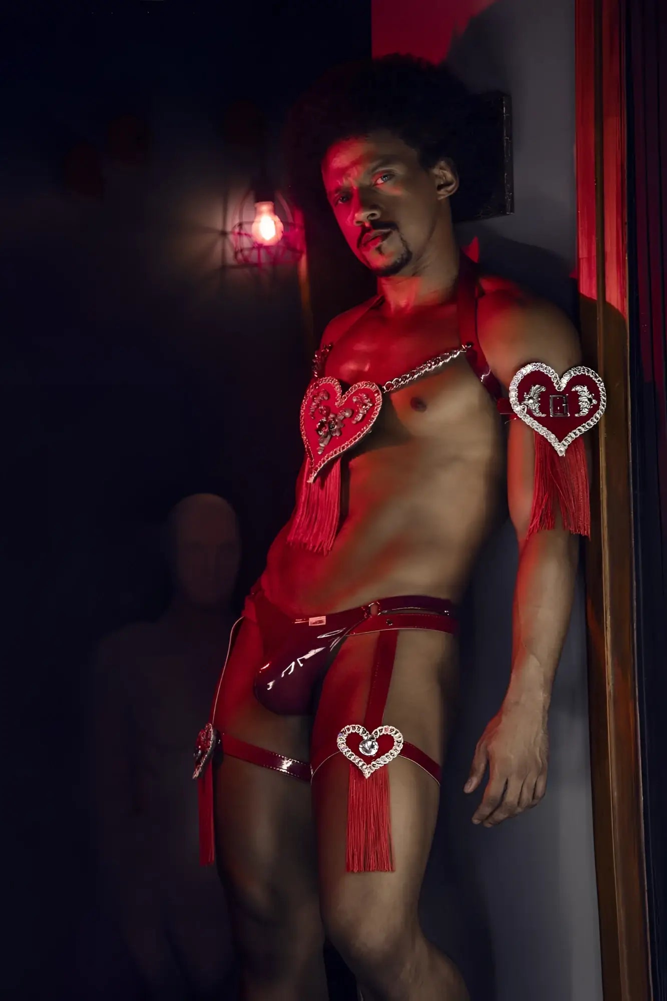 Red heart-shaped rhinestone embellishments with tassels on shiny wine gloss latex dom thongs candyMan 99819
