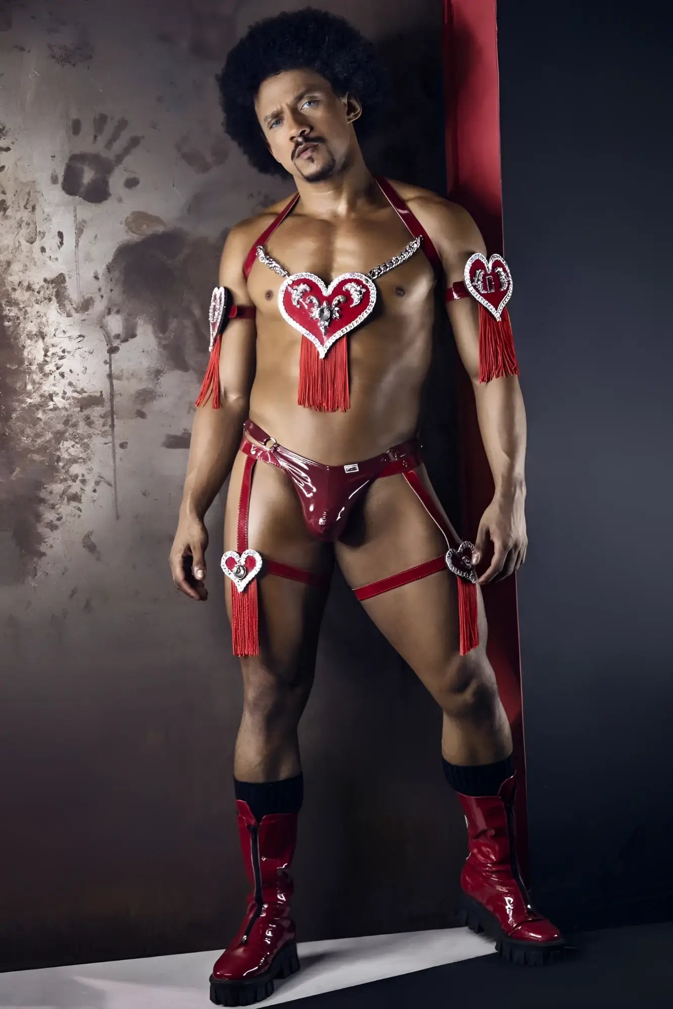CandyMan 99819 dom thongs in gloss wine red shiny latex with heart embellishments and tassels visible from the back side