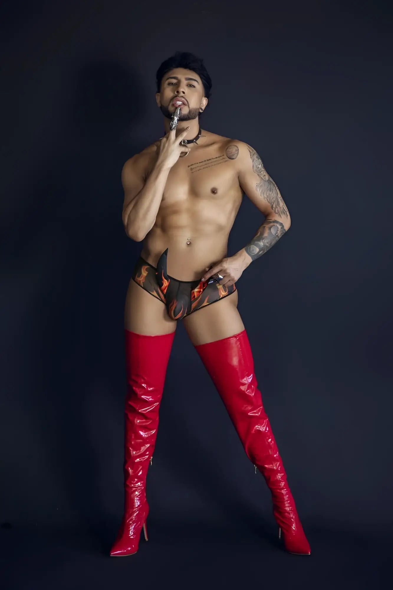 Shiny red thigh-high boots from candyman 99917 wicked trunks in black color with glossy finish
