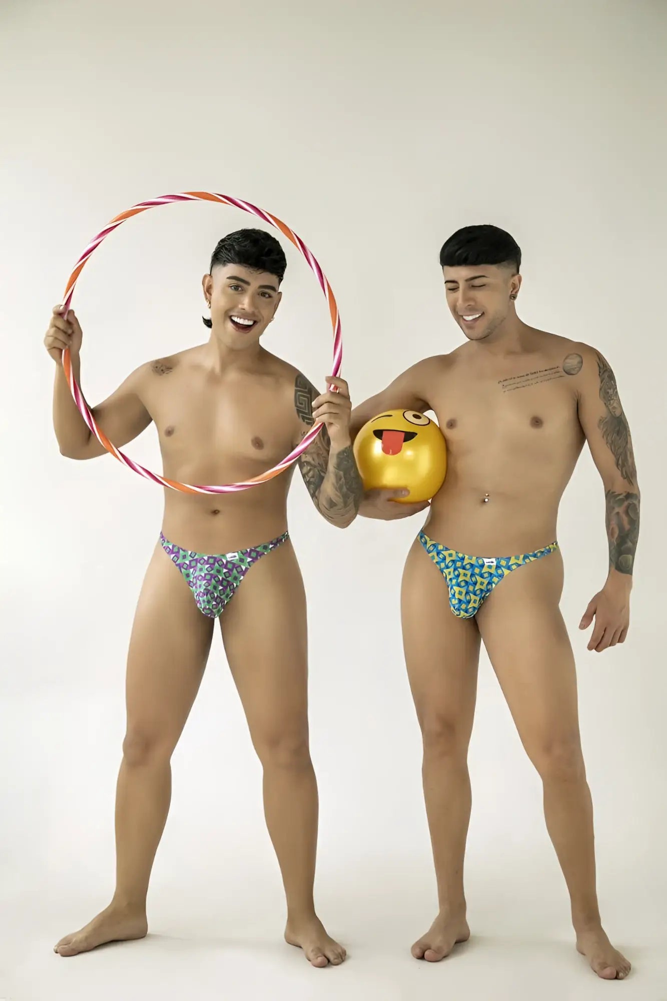 CandyMan 99924 thongs color printed turquoise shown with a colorful striped hula hoop in orange and pink hues