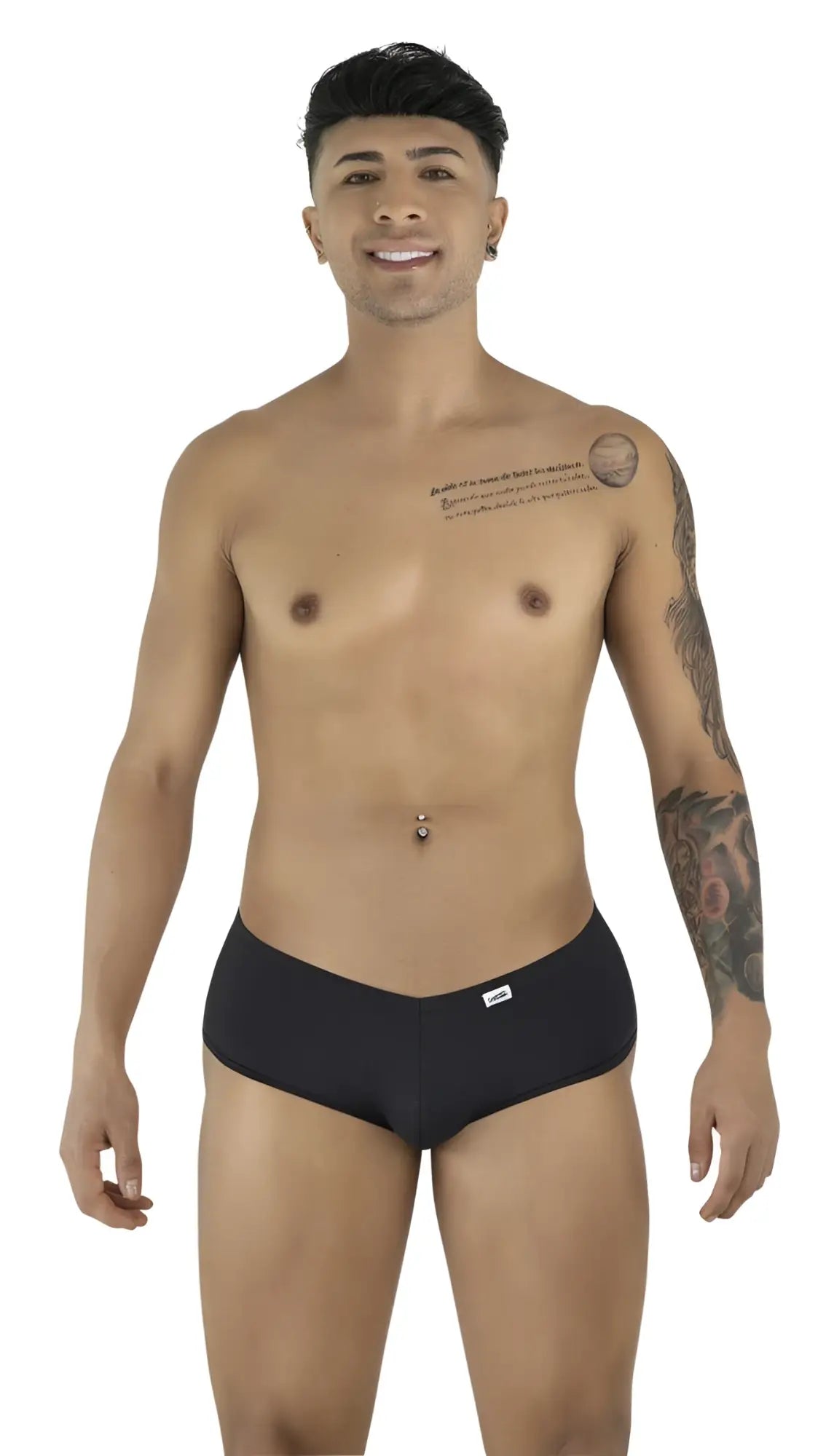 Model poses wearing black CandyMan trunks with a low-rise, form-fitting cut against a plain white background.