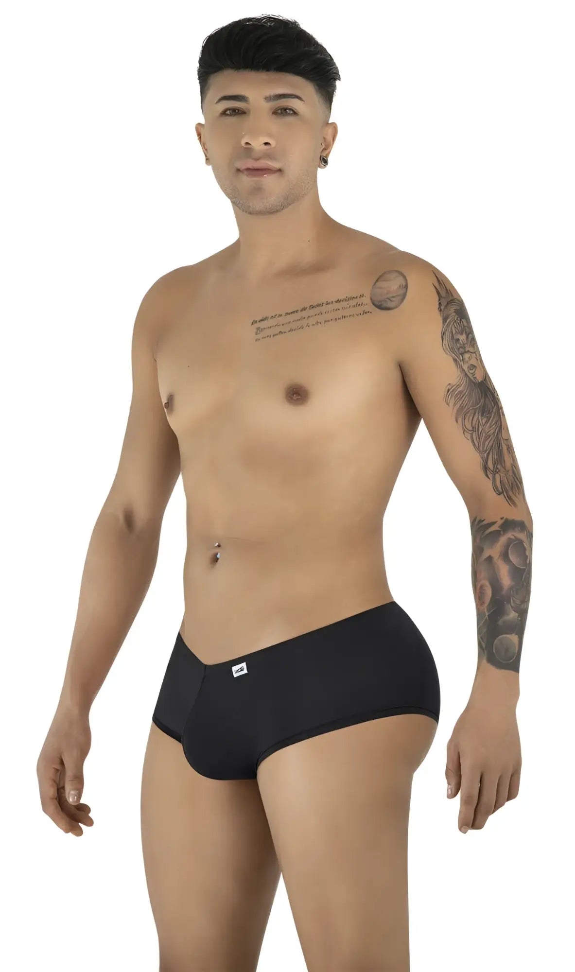 CandyMan 99943 black low-rise trunks with form-fitting cut on a tattooed model posing against a white background.