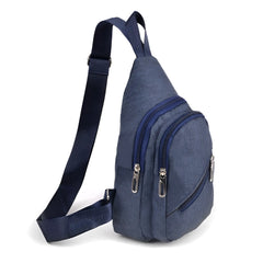 Navy blue canvas sling bag with denim texture multiple zippered compartments and silver toned zippers