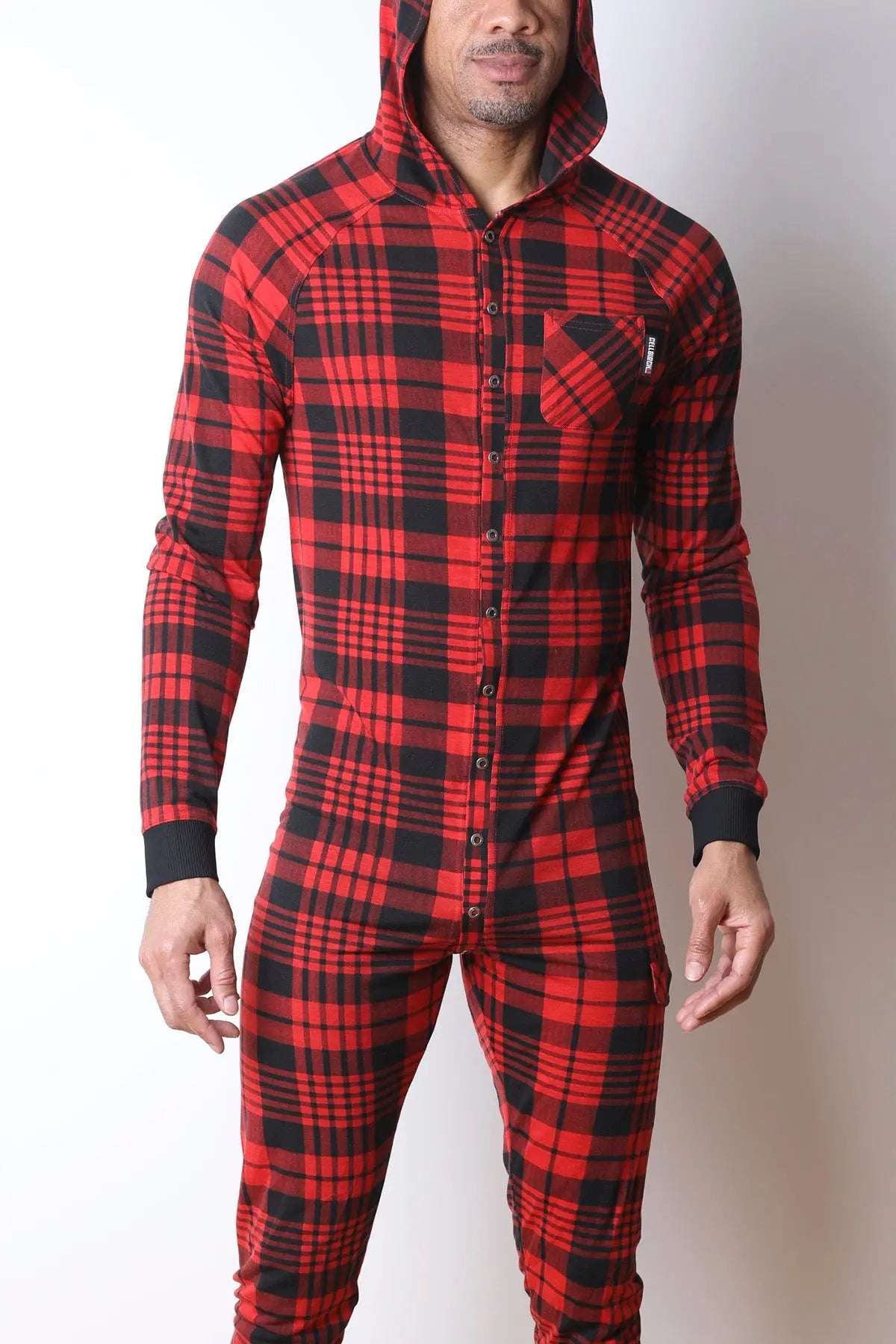 Man wearing red and black plaid hooded union suit with snap button front and chest pocket by CellBlock 13